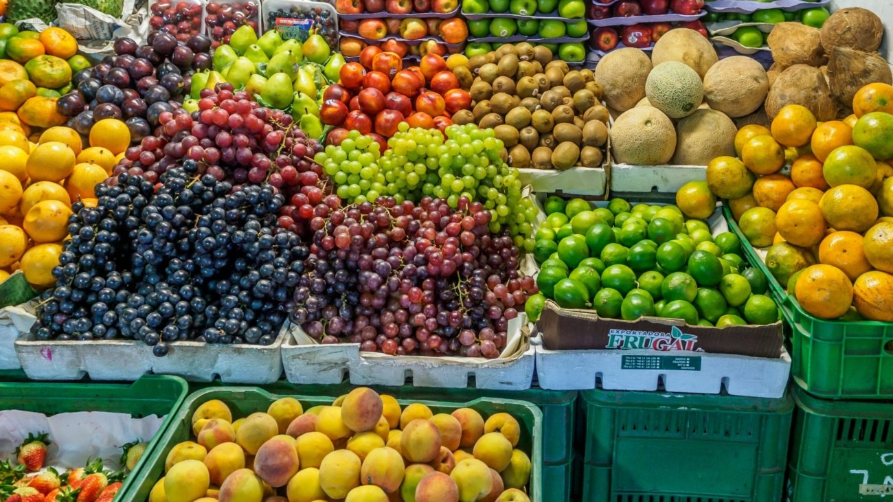 green and red apples on blue plastic crate