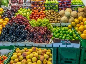 green and red apples on blue plastic crate